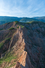 Fototapeta premium Badlands and village in the Sierra Nevada mountains (Spain)