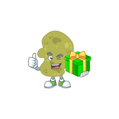 Happy smiley verrucomicrobia cartoon mascot design with a gift box