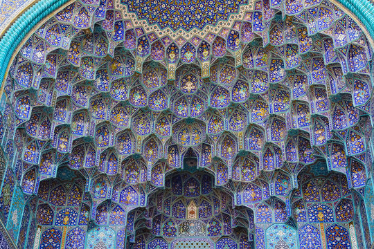 Colorful oriental geometric design and pattern commonly met in Persian mosques and medresses. Isfahan, Shiraz, Teheran, Iran