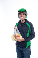 man courier with groceries on a plastic bag isolated over white background