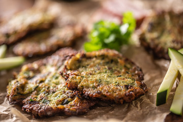 Crunchy zucchini pancakes with bacon parsley herbs and other ingredients