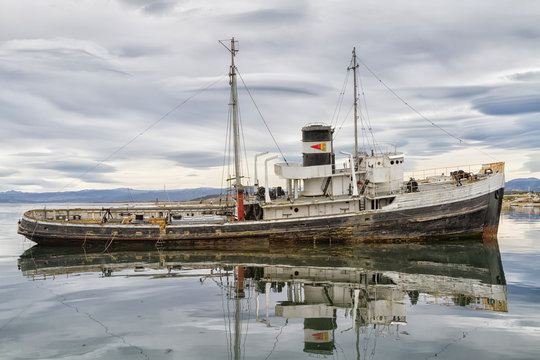 The wreck of the Saint Christopher aground in the harbor of Ushuaia. The Saint Christopher is an American-built rescue tug that served in British Royal Navy in WWII