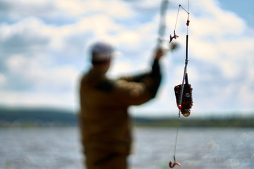 throwing a filled feeder . Closeup of feeder fishing