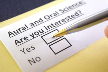 Obraz premium One person is answering question about aural and oral science.