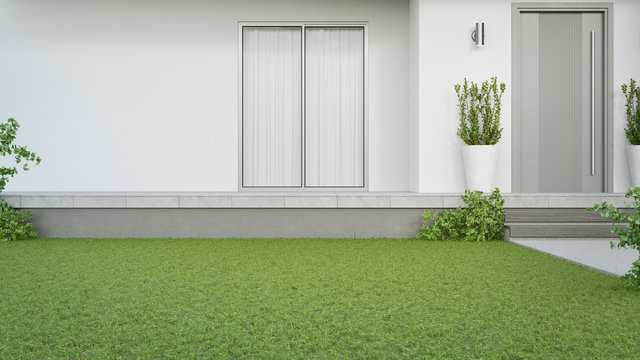 New House With Gray Door And Empty White Wall. 3d Rendering Of Green Grass Lawn In Modern Home.