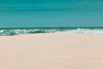 white sandy beach and turquoise sea water on sunny day