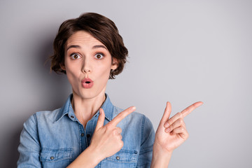 Portrait of astonished girl point index finger copyspace indicate incredible adverts promo...