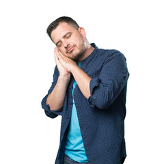 Young man wearing a blue outfit. Looking sleepy.