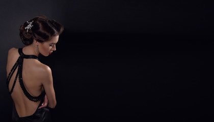 Beautiful gorgeous woman with elegant wavy hairstyle, bright make up.