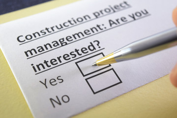 Obraz premium One person is answering question about construction project management.