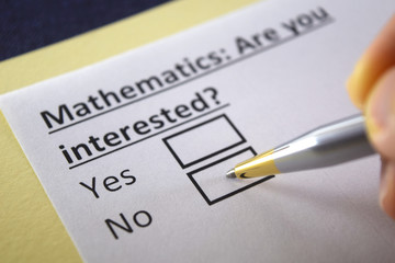 Obraz premium One person is answering question about mathematics.