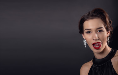 Beautiful gorgeous woman with elegant wavy hairstyle, bright make up.
