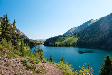Fototapeta na wymiar Amazing high-mountain crystal lake in Kazakhstan
