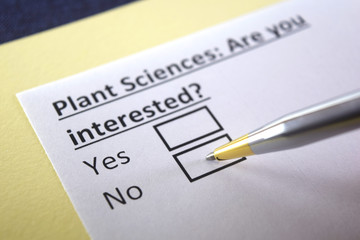 Obraz premium One person is answering question about plant sciences.