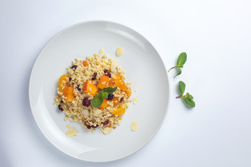 Healthy food on a white plate and a white background.