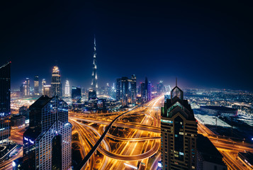 Fototapeta na wymiar Dubai skyscraper at night from the roof of a building