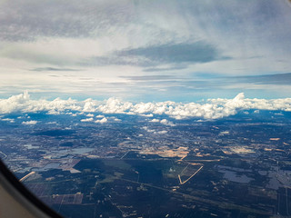 Landscape window view airplane flight approach kuala lumpur airport sky clouds low clear view asia malaysia airport city