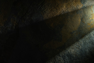 light prism with beam on dark stone texture background