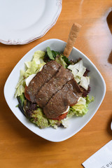 healthy salad plate, pieces of meat and high protein