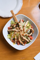 healthy salad plate, chicken pieces on it