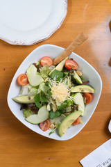 avocado, tomato, lettuce, green apple, mixed salad ready for presentation