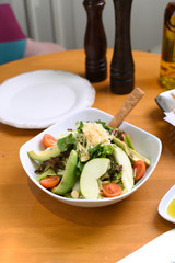 avocado, tomato, lettuce, green apple, mixed salad ready for presentation