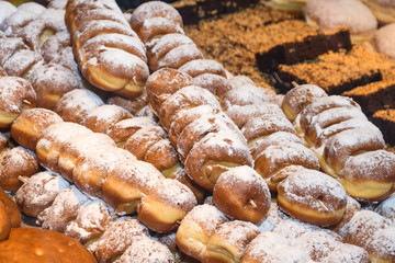 Display of traditional doughnuts on sale at Christmas market stall in Austria