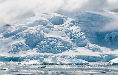 Mountains with crevassed glaciers, ice-falls and icebergs, Antarctic Peninsula