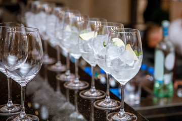Glasses, standing in two rows, with ice .Preparing for the Banquet.