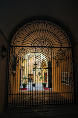 Beautiful arched wrought iron gates to the old courtyard