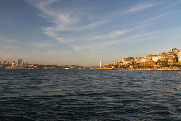 Fototapeta premium View of the Uskudar district of Istanbul from the Bosphorus at sunset. Turkey