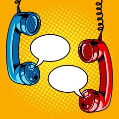 Two hanging phone handsets with empty speech bubbles. Pop art vector retro illustration.