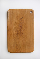 Solid wooden cutting board, handmade  isolated on white background.