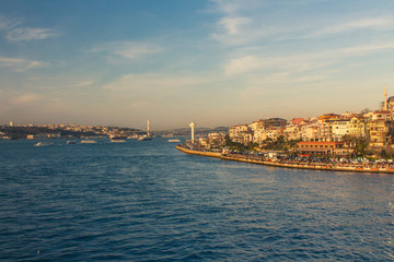 View of the Uskudar district of Istanbul from the Bosphorus at sunset. Turkey