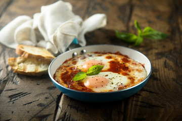 Fried eggs with tomato sauce or shakshuka