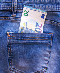 Twenty euros in the back pocket of your jeans. The concept of pocket money. Cash. Close up