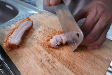 traditional Thai culture air fryer fried pork cuisine style or moo tod krob favorite famous street fast foods menu at thailand homemade
with hot spicy sauces on table wood dish sticky rice vegetable