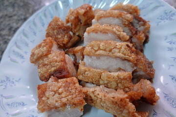 traditional Thai culture air fryer fried pork cuisine style or moo tod krob favorite famous street fast foods menu at thailand homemade
with hot spicy sauces on table wood dish sticky rice vegetable