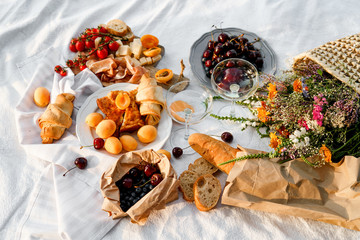 Top view of summer picnic with wine and snacks