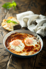 Fried eggs with tomato sauce or shakshuka