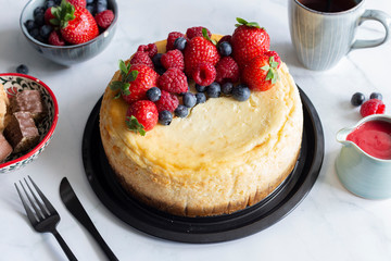 Raspberry and blueberry cheesecake tea party flat lay 