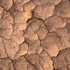 Nature background of cracked dry lands. Natural texture of soil with cracks. Broken clay surface of barren dryland wasteland close-up. 