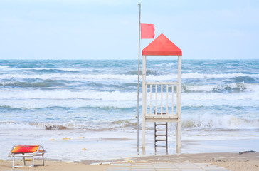 Empty beach due to corona lockdown, orphaned beach attendants post, mediteranean coast in italy,...