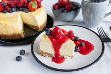 Raspberry and blueberry cheesecake tea party flat lay 