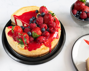 Raspberry and blueberry cheesecake tea party flat lay 