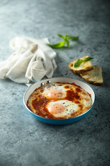 Fried eggs with tomato sauce or shakshuka