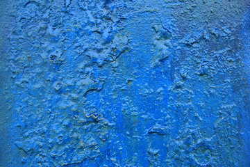 background iron painted blue wall with cracks