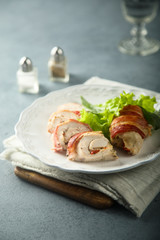 Chicken rolls with bacon, bell pepper and cheese