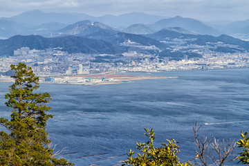 Panorama of Miyajima island seen from the mountains. Miyajima with its Itsukushima Jinja shrine is...