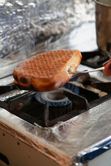 Disinfection of buns with open flame gas burner at home